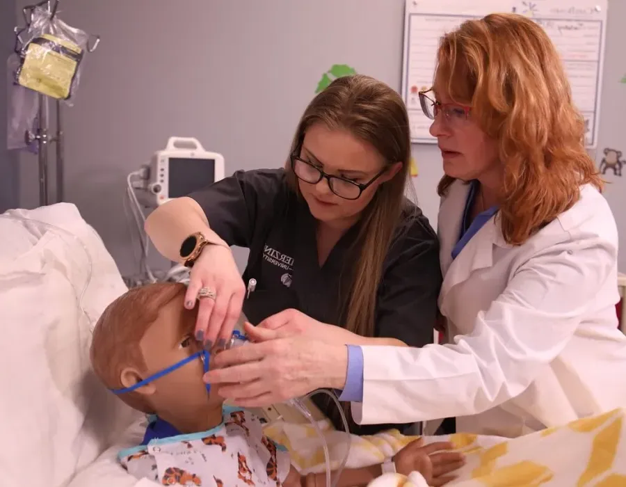 LPN to RN Student in Simulation Lab with Nursing Instructor